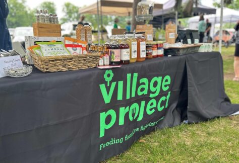 Village Project table at BAYarts Thursday Market