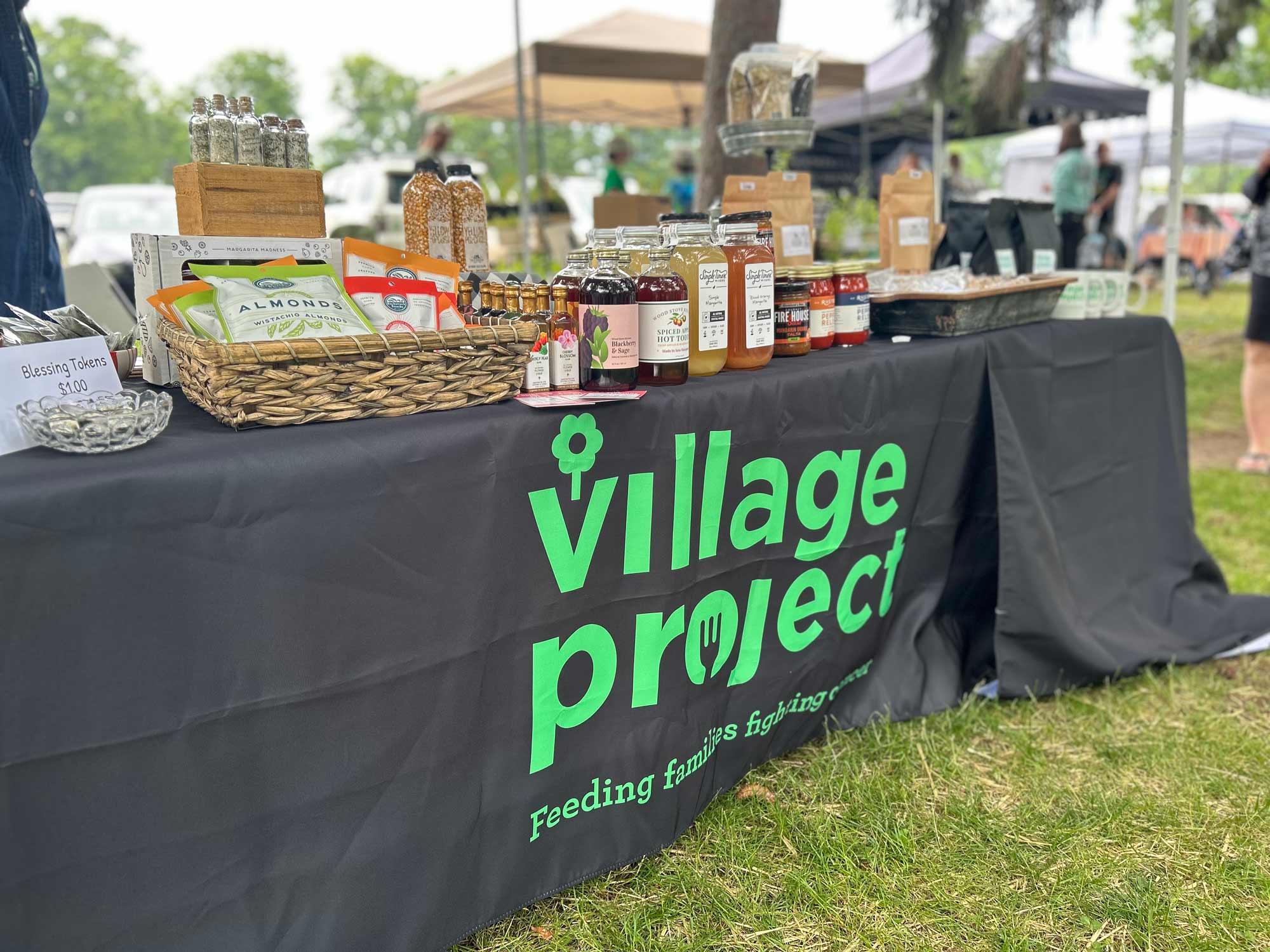 Village Project table at BAYarts Thursday Market